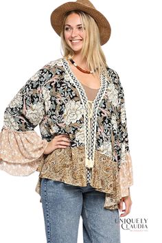 Wear our Savannah Floral and Paisley Print Mix Kimono practically anywhere! This soft, flowing style, goes great with your favorite jeans, shorts or dress! It features a lightweight woven fabric in tones of a pink, green, beige, and black print falls from a V-neckline with tassel tie and lace crochet trim into kimono ruffled sleeves! 100% Rayon Cold Wash. Do Not Bleach Also available in Edgy Plus Imported Hippie Style Rayon Tops For Spring, Fall Vacation Paisley Print Blouse, Bohemian Rayon Blouse For Spring, Spring Boho Print Trendy Blouse, Spring Boho Print Rayon Blouse, Boho Print Rayon Blouse For Beach, Boho Print Rayon Blouse For The Beach, Spring Rayon Blouse With Boho Print, Spring Bohemian Viscose Tops