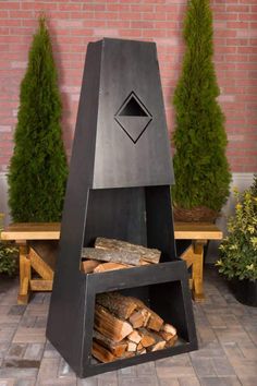 an outdoor fire pit with logs in it