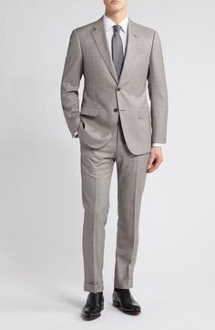 Dapper and distinctive, this pale-brown wool suit features traditional detailing and makes a smart choice for warm-weather occasions. Jacket has notched lapels; four-button cuffs; chest pocket; flap pockets; side vents Trousers have zip fly with button-tab closure; slant pockets; back button-welt pockets Jacket is lined; trousers are lined to the knee 100% virgin wool Dry clean Imported Armani Men Suits, Armani Suits For Men, Brown Double-breasted Suit With Pockets, Brown Tailored Double-breasted Suit, 80s Armani Suit, Armani Suits, Pocket Jacket, Wool Suit, Flap Pocket