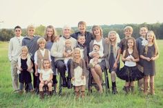 a large group of people posing for a photo