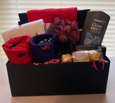 a box filled with assorted items sitting on top of a table