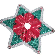 a green and red star shaped ornament