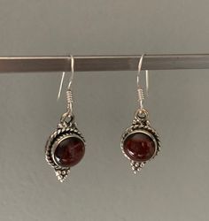 Sterling silver boho Garnet earringsMatching necklace  available. Handmade Silver Earrings With Garnet, Garnet Gemstone Earrings As A Gift, Silver Garnet Dangle Earrings, Silver Garnet Drop Earrings, Silver Garnet Birthstone Earrings, Bohemian Birthstone Earrings As Gift, Nickel Free Garnet Earrings Gift, Silver Garnet Jewelry With Matching Earrings, Garnet Earrings Silver