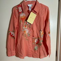 Nwt Susan Graver Branded Long Sleeve Button Down Top Featuring Floral Embroidery. A Peach Coral Like Striped Top With Floral Embroidery At Front And Sleeves. Buttons Down Front. 100% Cotton Bust Measurement Laid Flat Is Approximately 20 Inches Length From Back Neckline To Bottom Hem Is Approximately 26 Inches 50 B731 Spring Button-up Blouse With Multicolor Embroidery, Spring Embroidered Tops With Buttons, Spring Tops With Multicolor Embroidery And Buttons, Spring Multicolor Embroidered Tops With Buttons, Embroidered Multicolor Tops With Buttons For Spring, Spring Embroidered Top With Button Closure, Spring Multicolor Embroidered Top With Button Closure, Multicolor Embroidered Top With Button Closure For Spring, Blue Button Up Shirt