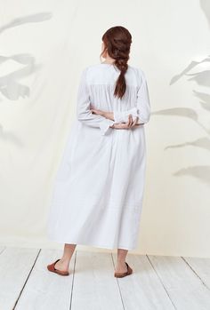 Our best selling Dobby Stripe Collection is now available with a coordinating button front robe. This can be worn alone as a nightie or as a robe to make a perfect set with the Dobby Stripe Ballet Gown. A clean and classic look, this 100% cotton robe is designed with a delicate dobby stripe, accented by venise lace at the neckline, pintucks at the neckline and skirt, and a full button front of shimmery akoya buttons. The Robe is 52" inches long and has ruffle elastic sleeves and side seam pocket Eileen West, Color Switch, Cotton Nightgown, Pin Tucks, Cotton Weaving, Night Gown, Classic Looks