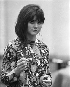 black and white photograph of a woman holding an apple