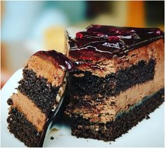 a piece of chocolate cake on a plate with a fork