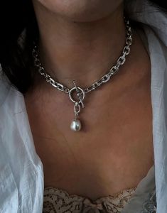 ▪  A beautiful necklace made of a Sterling silver 925 thick cable necklace with a toggle clasp and decorated with a Swarovski Pearl.    The necklace is suitable for any occasion, both morning and evening.    ▪  SIZE Length: 15" (38 cm) up to 19.8" (50 cm)                                                                                     Width Toggle:  0.78 " (2cm).    Width Bar: 1.26" (3.2cm)    Width chain: 0.35"  (0.9cm)    Thick link: 0.08" (2mm)    The weight of the chain measures 15.8" (40 Handmade Silver Toggle Necklace, Silver Toggle Necklace With Clavicle Chain, Silver Lariat Toggle Necklace Gift, Silver Pendant Toggle Necklace With Lobster Clasp, Silver Toggle Pendant Necklace With Lobster Clasp, Elegant Metal Toggle Necklace With Silver Chain, Elegant Silver Toggle Necklace With Clavicle Chain, Silver Toggle Necklace With Chain As Gift, Silver Pendant Toggle Necklace With Chain