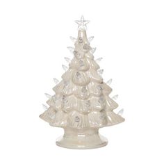 a white ceramic christmas tree with clear lights