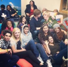 a group of young people sitting next to each other