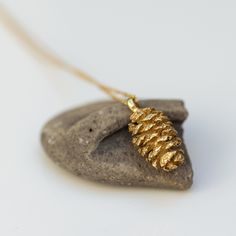 This 14k solid gold pinecone necklace is a true embodiment of nature's charm. Each pendant is carefully crafted from a natural pinecone, capturing its intricate details and organic beauty. No two necklaces are alike, each as unique as the natural world. * Pinecone length between 1-2cm, different between each pinecone * Material: 14K Solid Gold * Gold Color: Yellow Gold, White Gold, Rose Gold * Every pinecone is unique. While creating your jewelry, we aim to make it very similar to the sample ite Nature-inspired Recycled Gold Jewelry For Gifts, Nature-inspired Recycled Gold Jewelry Gift, Pine Cone Jewelry, Pinecone Necklace, Pinecone Pendant, Book Jewelry, Types Of Diamonds, Brown Diamond, Champagne Diamond