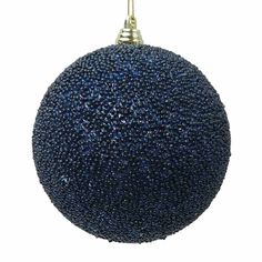 a blue ball ornament hanging from a gold chain