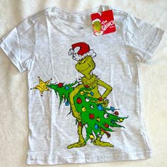 Brand New Grinch Size 4 Light Gray Shirt Sleeve T-Shirt Grinch Printed In Front Super Cute And Nice Cotton *Check Out My Closet For More Adorable Listings *10% Off When You Purchase 3 Listings Happy Shopping Holiday Cotton Tops With Character Print, Holiday Cotton Top With Character Print, Cotton Top With Character Print For Holidays, Holiday Crew Neck Top With Character Print, Casual Character Print Tops For Holiday, Casual Holiday Tops With Character Print, Casual Character Print Holiday Tops, Grinch Shirts For Kids, Ham Shirt