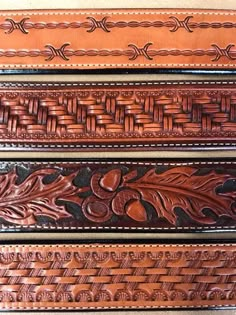 three leather belts with decorative designs on them