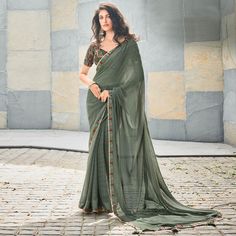 Olive Green colored saree is prettified with printed & gota patti work as shown which makes it appear classy. This saree is made of georgette fabric which is accompanied with georgette blouse piece which you can customise as per your design/style. Women can buy this saree to wear for their casual, daily and homely events and ideal for any fashionista. Note:- The actual product may differ slightly in color and design from the one illustrated in the images when compared with computer or mobile scr Festival Georgette Pre-draped Saree With Printed Border, Georgette Saree With Printed Border For Diwali, Semi-stitched Chiffon Pre-draped Saree For Festivals, Festive Georgette Saree With Printed Border, Pista Green Embroidered Blouse Piece For Festivals, Festival Blouse Piece In Pista Green With Embroidered Border, Eid Georgette Blouse Piece With Printed Border, Festive Georgette Traditional Wear With Printed Border, Unstitched Georgette Blouse Piece With Embroidered Border