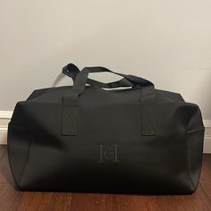 New In Original Bag Spacious, Fit Most Travel Needs . Zip Around Zipper. 18”X8”11” Elegant Black Duffle Bag For On-the-go, Black Crossbody Duffle Bag For Travel, Black Crossbody Weekender Bag For Travel, Elegant Black Duffle Bag With Removable Pouch, Black Large Capacity Crossbody Weekender Bag, Large Capacity Black Crossbody Weekender Bag, Black Rectangular Duffle Bag With Adjustable Strap, Everyday Black Tote Duffle Bag, Elegant Black Duffle Bag With Adjustable Strap