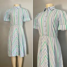 "Lovely 1960s Dress by Schrader Sport Petite It has a great midcentury striped pattern in blue and green. It has 6 front buttons over the waist. 65% polyester, 35% cotton. In great vintage condition. RN number. VIntage size 4. Estimated best fit sizes XS/S. (Mannequin measures 34\" in the bust area, 26\" in the waist, and 36\" in the hip) Approx Flat Measurements: Bust: 34\" Waist: 29\" Length: 43\" All measurements are taken with the garment flat, doubled for the bust (chest), waist, hips, and Blue Short Sleeve Vintage Dress For Summer, Short Sleeve Vintage Dress For Summer, Summer Vintage Dress With Short Sleeves, Mid-century Style Short Sleeve Vintage Dress, Green Retro Vintage Dress With Short Sleeves, 1950s Vintage Short Sleeve Dress For Spring, 1950s Vintage Spring Dress With Short Sleeves, 1950s Style Short Sleeve Vintage Dress For Spring, 1950s Style Short Sleeve Summer Dress