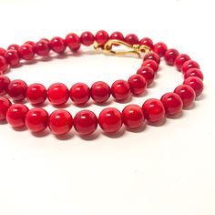 This pretty coral beads necklace is made with natural coral beads.  Each bead is unique with various shades of red. You will see some roughness and imperfection, but overall, they are shiny and luster. Material: Red coral beads (color enhanced) Beads size: 9mm-10mm Color: Red Length: 18 inches. 20 inches, 22 inches, 24 inches Closure:  Gold plated S hook. Let me know if you want different length of this necklace. It may take 2-3 days to make it. Red Coral Beaded Bracelet With Polished Beads, Red Coral Beaded Bracelets With Polished Beads, Red Coral Round Beads Single Strand, Red Beaded Bracelet With Polished Red Coral, Single Strand Red Coral Round Beads, Single Strand Red Coral Beads For Jewelry Making, Hand-strung Red Coral Beaded Necklaces, Single Strand Red Coral Beads, Single Strand Round Red Coral Beads