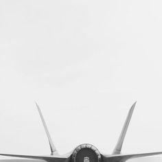 the tail end of an airplane in black and white