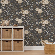 a wallpapered room with flowers and baskets on the floor in front of it