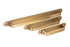 three brass door handles on a white background