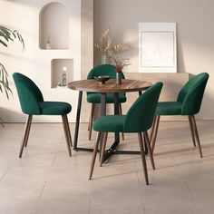 a dining room table with green chairs around it