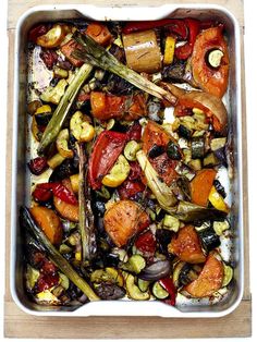 a casserole dish filled with roasted vegetables