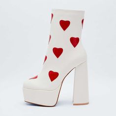 Elevate your style with these white square toe block heel platform ankle boots featuring a charming heart detail. Strut in comfort and chic fashion with this unique and trendy footwear choice. Color: White Material: Faux leather Heel Type: Block heel Heel Height: 4.72" / 120 mm approx Platform Height: 2'' / 50 mm approx Product measurements were taken using size 8. Please note that measurements may vary by size. Toe: Square toe Heart detail design Side-zip design Handcrafted US sizing. Fits true to size. White High Heel Platform Boots With Chunky Platform, Trendy White High Heel Platform Boots, White High Ankle Platform Boots, White Square Toe Platform Boots For Fall, Trendy White High Heeled Platform Boots, White Chunky Platform High Heel Boots, Trendy White Square Toe Heeled Boots, White Square Toe Platform Boots, White Platform Boots With Chunky Block Heel