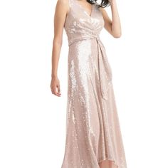 Katrina Sequin High-Low Gown Champagne Wishes Come True In This Gracefully Draped Gown, Dripping In Effervescent Sequins And Finished To Flow With A High-Low Hem. Pre-draped Evening Dress For Prom Season, Champagne Sleeveless Maxi Dress For Prom, Pink Sleeveless Mother Of The Bride Dress For Party, Sleeveless Champagne Bridesmaid Dress, Pre-draped Wedding Dress With Sequins, Sleeveless Pre-draped Gown For Party, Pre-draped Sequin Wedding Dress, Pre-draped Sleeveless Gown For Parties, Pre-draped Gown For Prom Season Party