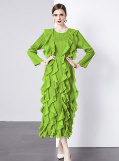 Emanate a vibrant energy in this striking green ruffle dress, a bold statement piece designed for the fearless fashion enthusiast. With its electrifying hue, this dress is a wearable expression of confidence and individuality. The unique pleated texture, combined with the cascading ruffles from the waist down, creates a sense of dynamic movement, echoing the rhythm of the wearer's stride. The elongated cuffs and structured shoulders craft a silhouette that's both modern and timeless. It's an ide Dark Green Ruffled Dress For Party, Green Ruffled Midi Dress For Party, Fitted Green Ruffle Dress For Spring, Dark Green Elegant Ruffle Dress, Elegant Dark Green Ruffled Dress, Dark Green Evening Dress For Spring, Elegant Dark Green Dress With Ruffles, Green Ruffle Dress For Summer Party, Fitted Green Dress With Ruffle Hem