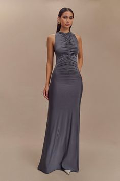 Sleek and sophisticated. The PRIYA Slinky Ruched Halter Maxi Dress is designed for the modern minimalist. With a refined racer front and back neckline, this sleeveless dress embodies effortless elegance. The front and back ruching detail enhances its bodycon silhouette, while the maxi length adds a touch of drama. Fully lined for a smooth finish, this maxi dress is a perfect choice for evening occasions where simplicity speaks volumes. Ruched Maxi Dress, Halter Maxi Dress, Club Dress, Halter Maxi, Halter Maxi Dresses, Effortless Elegance, Dress Maxi, Club Dresses, Womens Maxi Dresses