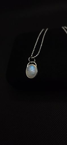 A stunning rainbow moonstone set in a handcrafted 925 sterling silver setting.  Necklace is a 925 sterling silver 18in chain. dropping item may result in damage to the stone **do not wear in water *prices can change due to metal price fluctuations. Dainty Moonstone Jewelry With Cabochon, Moonstone Pendant Jewelry Stamped 925, Dainty Silver Cabochon Jewelry, Sterling Silver Moon Charm Necklace With Oval Pendant, Sterling Silver Oval Pendant With Moon Charm, Sterling Silver Oval Necklace With Moon Charm, Sterling Silver Oval Necklace, Minimalist Silver Moonstone Jewelry, Silver Minimalist Moonstone Necklace