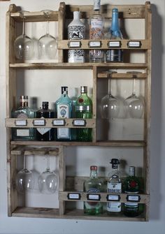 an old wooden shelf filled with bottles and glasses