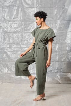 The Tie Back Jumpsuit is an easy-to-wear piece perfect for days when you're not in the mood to think about putting together a full outfit. Features a relaxed silhouette, self-tie back, 28" inseam, optional belt, and dropped kimono style sleeves. *This item can take up to 7 business days to ship as it is made to order for you. Workwear Jumpsuit With Tie Waist And Relaxed Fit, Summer Relaxed Fit Jumpsuits And Rompers With Tie Waist, Belted Relaxed Fit Jumpsuits And Rompers For Work, Relaxed Fit Belted Jumpsuits And Rompers For Work, Belted Relaxed Fit Jumpsuit For Work, Workwear Relaxed Fit Belted Jumpsuits And Rompers, Green Tie Waist Jumpsuit For Work, Relaxed Fit Cotton Jumpsuits And Rompers With Tie Waist, Relaxed Fit Cotton Jumpsuit With Tie Waist