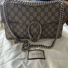 In Perfect Condition Silver Gucci Bag With Chain Strap, Luxury Shoulder Bag With Horsebit Detail, Silver Gucci Evening Bag, Gucci Silver Shoulder Bag With Silver-tone Hardware, Designer Gucci Silver Bag, Designer Silver Gucci Bags, Formal Silver Gucci Shoulder Bag, Gucci Bag Dionysus, Silver Wallet