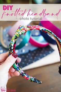 a hand holding up a colorful headband with the words diy folded headband on it