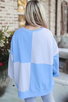 Features: High-Low Sheer: Opaque Stretch: No stretch Material composition: 65% polyester, 35% cotton Care instructions: Machine wash cold. Tumble dry low. Imported Size US Bust Shoulder Sleeve Length Top Length S 4 48.8 27.6 19.1 26 M 6/8 51.2 28.7 19.3 26.8 L 10/12 53.5 29.9 19.5 27.6 XL 14/16 56.7 31.5 19.5 28.3 2XL 18 59.8 33.1 19.5 29.1 About Us: Welcome to Lizzie's! We hope you find unique pieces you'll love for years! We've been in the fashion business since 2016. You'll love our products Blue Sweatshirt For Spring Layering, Blue Long Sleeve Sweatshirt For Layering, Blue Cotton Sweater For Fall, Color Block Cotton Tops For Fall, Blue Cotton Sweater For Spring, Light Blue Cotton Tops For Fall, Blue Patchwork Top For Winter, Oversized Light Blue Tops For Fall, Light Blue Relaxed Fit Tops For Fall