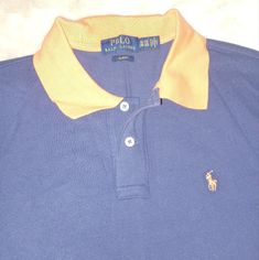 Dark Blue And Orange. Never Worn Size 18-20 Blue Long Sleeve Color Block T-shirt, Blue Color Block Polo Shirt, Navy Color Block Collared Top, Navy Collared Color Block Top, Ralph Lauren Polo Shirts, Ralph Lauren Shirt, Blue Orange, Kids Shirts, New Color