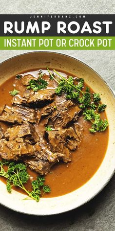 a white plate topped with beef and broccoli covered in gravy on top of a table