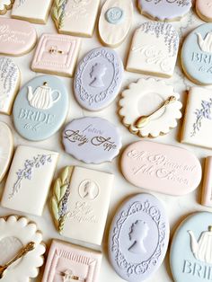 many decorated cookies are arranged on a table