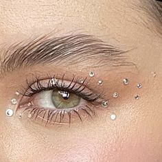 Glitter Rhinestone Eye Makeup, New Years Makeup Ideas With Gems, Diamonte Makeup Look, Face Jem Ideas, Minimal Rhinestone Makeup, Rhinestone Eyeliner Makeup, Sparkly Natural Makeup, Gold Star Eye Makeup, Simple Eras Tour Makeup