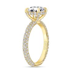 a yellow gold engagement ring with three stones on the side and two rows of diamonds in the center