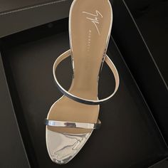 100% Authentic Giuseppe Zanotti Darsey Sandal In Silver Chrome. Brand New - Never Worn. Us Womens Size 42/ 12. Only Tried On Inside Of The House. These Have Been In The Box Since I Purchased Them, Never Got Around To Wearing Them Sadly. Comes With Box, Dust Bag, All Original Plastic And Paper Inserts, Along With Care Card/ Authenticity Card Info. Modern Sandals With Single Toe Strap For Cocktail, Designer High Heel Sandals For Gala, Modern Cocktail Sandals With Single Toe Strap, Luxury Silver Open Toe Mules, Designer Sandals With Heel Loop For Party, Designer Party Sandals With Heel Loop, Luxury Mules With Wrapped High Heel, Luxury Sandals With Padded Heel For Cocktail, Designer Evening Mules With Heel Loop