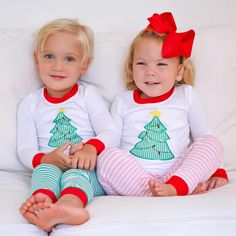 Make this Christmas even more magical with our Christmas Tree Pink Stripe Pajamas! The snug-fit long sleeve pajama top features our classic Christmas tree appliqué, spreading holiday cheer with every wear. The set includes pink striped pull-on pajama pants, ensuring your little one stays warm and comfy all night. Add a monogram to personalize this festive look for an extra special Christmas touch! Designed to be snug-fitting. Please check the Size Chart for measurements and order accordingly. Monogram Christmas Pajamas, Monogrammed Christmas Pajamas, Christmas Pajamas Baby, Childrens Christmas Pajamas, Green Plaid Dress, Baby Girl Christmas Pajamas, Red Plaid Dress, Girls Thanksgiving, Magnolia Baby