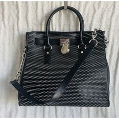 Michael Michael Kors Black Studded Leather Ns Hamilton Satchel Satchel Is In Good Condition (Other Than Some Scuffs On The Hardware) And Comes From A Smoke Free And A Pet Free Home. Length 13 Inches Height 12.5 Inches Depth 6 Inches Baghdad Top Handles, A Shoulder Strap, A Magnetic Snap Closure, An Interior Zip Pocket And Interior Slip Pockets. Bag Has Silver Toned Studs And Hardware. Leather Party Bag With Silver Accents, Party Leather Bag With Silver Accents, Leather Evening Bags With Silver Accents, Luxury Leather Bag With Silver Accents, Evening Leather Bags With Silver Accents, Black Luxury Bags With Silver Accents, Luxury Black Bags With Silver Accents, Designer Silver Textured Leather Bag, Evening Leather Shoulder Bag With Silver Accents