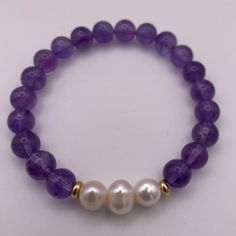 DESCRIPTION: Amethyst and pearl bracelet, combining the subtle charm of amethyst with the classic elegance of pearls. A versatile and sophisticated accessory for any occasion. FEATURES: Genuine Stones & Pearls. 10mm beads. Filled gold 18k. Elegant Amethyst Rondelle Beaded Bracelets, Elegant Purple Rondelle Beaded Bracelets, Elegant Amethyst Beaded Bracelets, Classic Amethyst Bracelets In Purple, Classic Amethyst Purple Bracelets, Classic Purple Amethyst Bracelets, Elegant Lavender Beaded Bracelets With Gemstone, Elegant Purple Rondelle Bracelets, Elegant Lavender Gemstone Beaded Bracelets