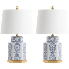 two blue and white ceramic lamps with gold bases