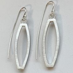 Sterling Silver Open Weave Lightweight Earrings hangs 2 inches from top of ear wire  1/2 inch wide  Stamped .925 Sterling Silver  Oval Shaped  Textured Finish Lightweight Earrings  Earrings you can live in! Our Jewelry is handmade with Love using Solid Sterling Silver Stamped .925 in my studio! PROCESSING TIME: 1 day! SHIPPING: US Orders Ship 1st Class Mail in 2 BUSINESS DAY! With A Tracking # ! SHOP POLICY: My Shop is open Monday thru Friday! Closed on weekends and holidays. But I do check on and will reply to all messages through out the weekend! CARE INSTRUCTIONS: Sterling silver jewelry looks great with your beachwear but don't go in the water with them. They will tarnish and can become damaged by exposure to pool and saltwater. Water, in and of itself, doesn't cause damage. Keep your Modern Handmade Oblong Earrings, Modern Oblong Sterling Silver Earrings, Modern Sterling Silver Oblong Earrings, Minimalist Sterling Silver Oblong Earrings, Modern Oval Teardrop Earrings For Pierced Ears, Modern Oval Earrings With Ear Wire, Elegant Metal Oblong Earrings, Modern Oval Pierced Earrings, Silver Oblong Earrings