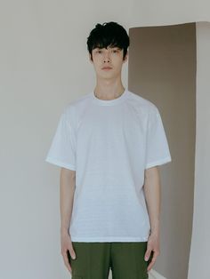 Editor's NoteThe must-have, basic t-shirt features semi-oversized fit and soft touch- Short sleeve t-shirt made of modal fabric that features quality and soft touch- Round neckline- Relaxed fit- Dropped shoulderMeasurements (in.)- M:       Length     27.6in.,        Shoulder     7.9in.,        Chest     21.7in.,        Sleeve     8.3in.             - L:        Length     28in.,        Shoulder     20.5in.,        Chest     22.5in.,        Sleeve     8.7in.              - XL:        Length     28.4in.,        Shoulder     20.9in.,        Chest     23.3in.,        Sleeve     9.1in.*Model Info- 6' 01, 157lbs, Wearing size LComposition & Care- 52% Cotton, 48% Polyester- Dry clean or hand wash- There may be possibilities for staining if you wash and wear the product with a combination White Relaxed Short Sleeve T-shirt, Classic Plain T-shirt With Relaxed Fit, Classic Relaxed Fit Plain T-shirt, Relaxed Fit T-shirt For Everyday, Minimalist Relaxed Fit T-shirt, Classic Oversized T-shirt For Spring, White Relaxed Fit Minimalist Top, Simple Relaxed Fit T-shirt For Everyday, Simple Boxy Fit T-shirt For Everyday