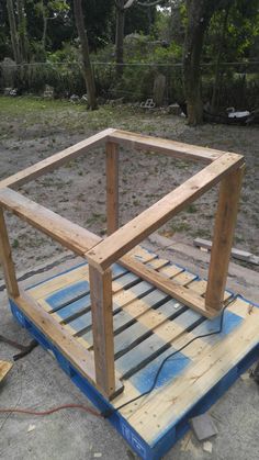 a wooden frame sitting on top of a pallet